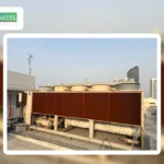 Rooftop industrial chiller system featuring a large heat exchanger for efficient cooling performance 